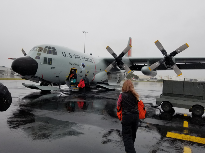 Rysewyk boarding the C-130 cargo plane that took IceCubers and other visitors from Christchurch, New Zealand, to NSF's McMurdo Station. Three attempts were needed to make the trip successfully after "boomeranging," turning around mid-flight due to weather complications.