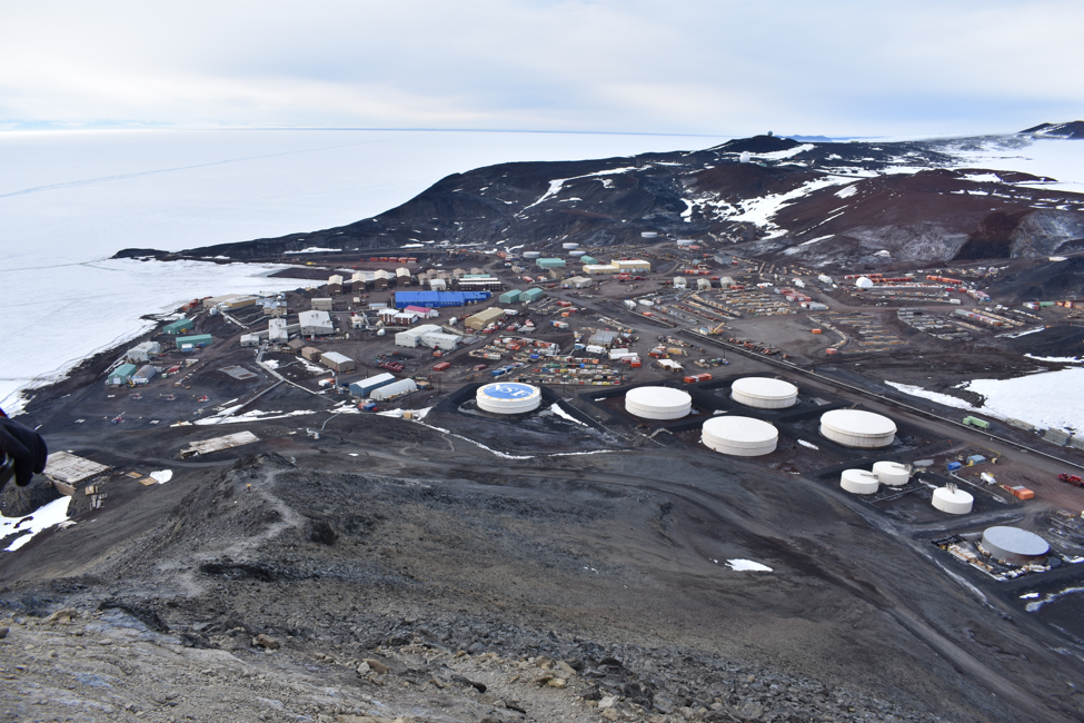 NSF's McMurdo Station, located on southern coast of Ross Island in Antarctica, from the summit of Observation Hill. Rysewyk and teammates spent some time exploring the terrain around the station while their flight from McMurdo to the Pole was delayed by bad weather.