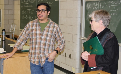 The presentation of the President's Distinguished Teaching Award is intended as a surprise for the recipient. Here, the surprise involves an unannounced visit by MSU President Lou Anna K. Simon to Asst. Prof. Danny Caballero's PHY481 class.